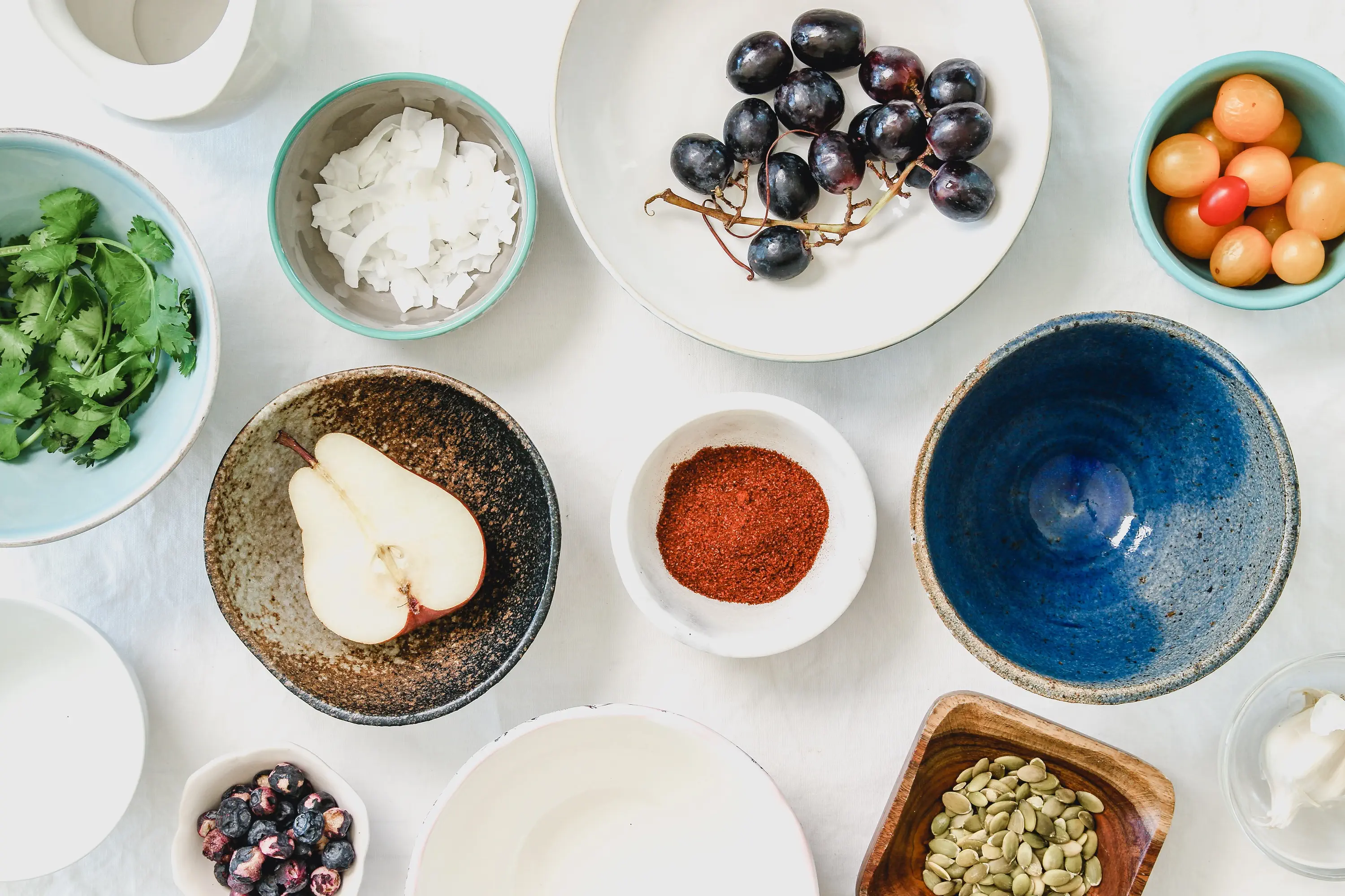 bowls with spices and fruits